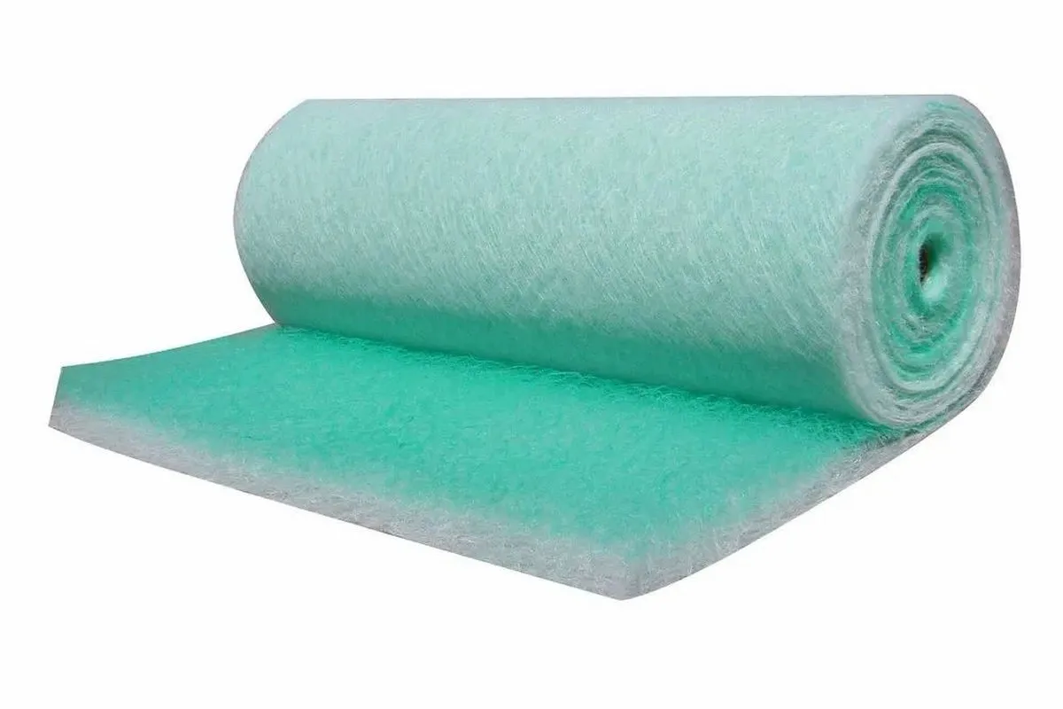 Green and white progressive-density glass fibre paint arrestor roll, partly unrolled